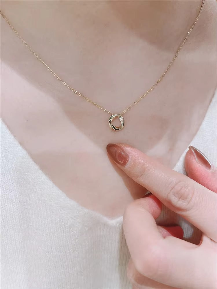 Gilded Twisted Ring Pendant Necklace