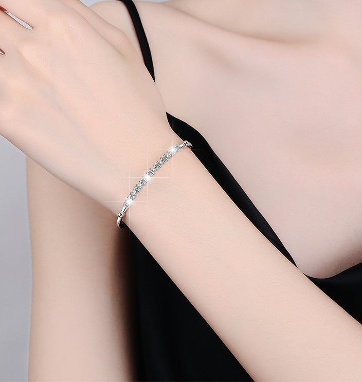 Discover the Brilliance of our 1 Carat Moissanite Bangle Bracelet in Platinum Overlay Silver